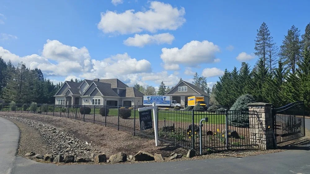 Easier Moving and Penske trucks at a gated Willamette Valley estate
