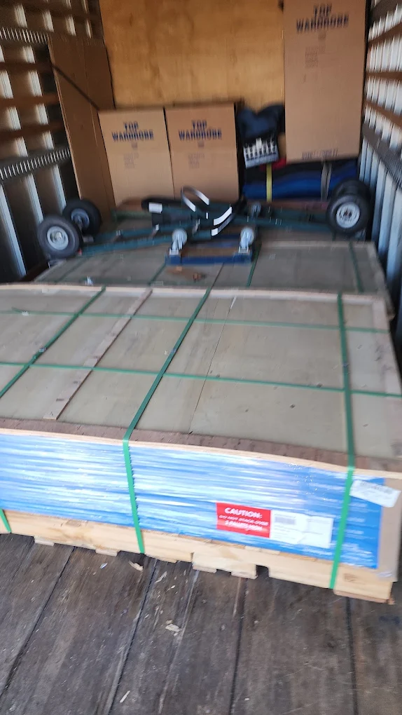 Banded flooring pallet strapped inside the truck