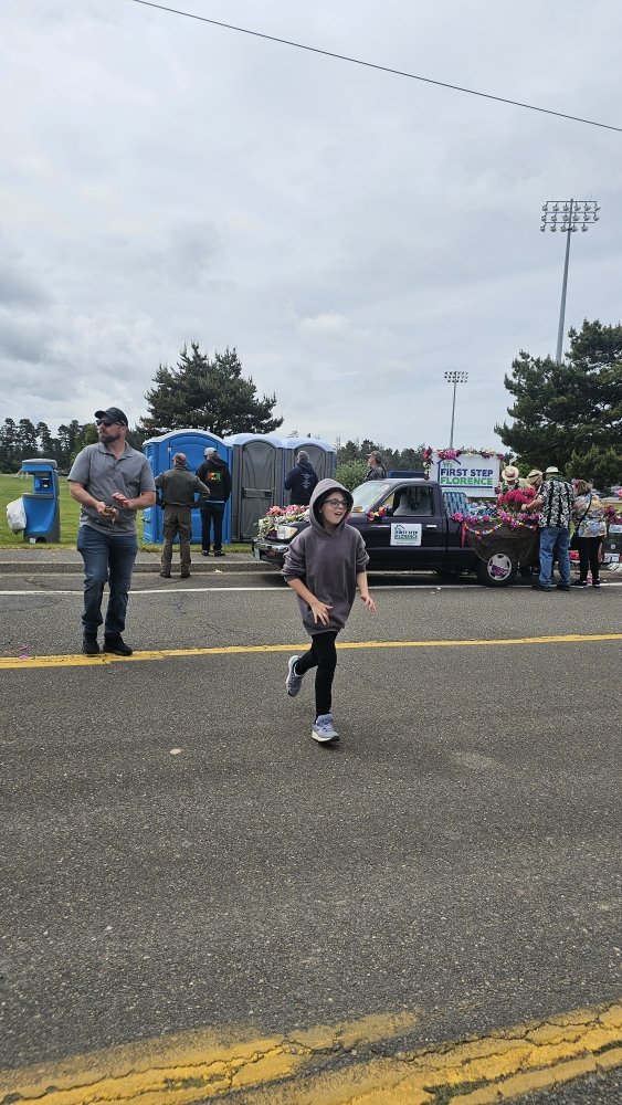 Kid running the parade route