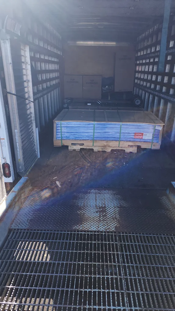 Pallet staged on the truck deck at the liftgate
