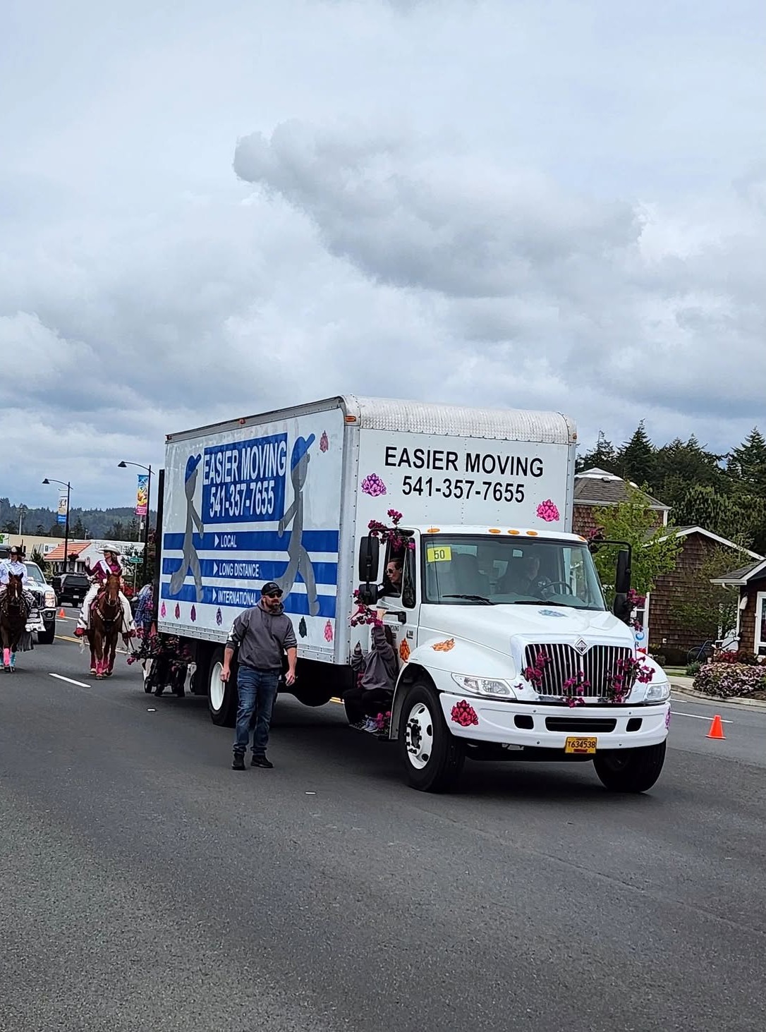 Easier Moving truck decorated with flowers leading the Florence parade