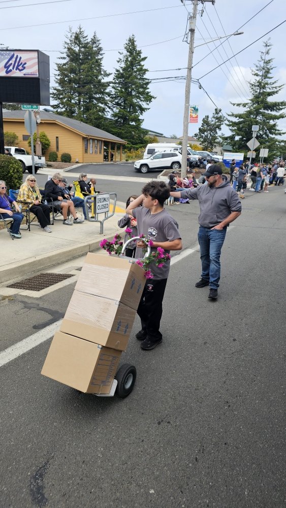 Crew crossing the street with boxes